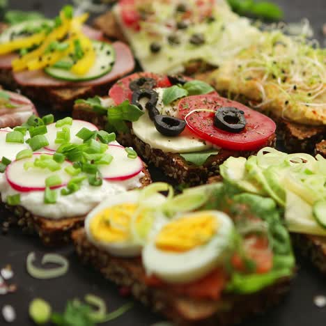 top view of different decorated sandwiches as appetizer  healthy food  vegetable meal