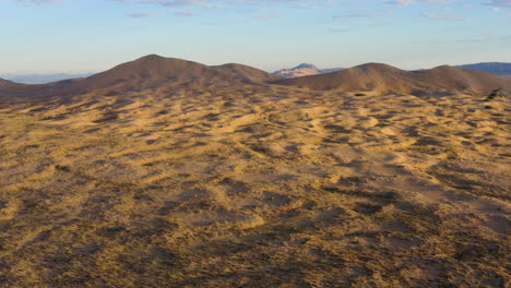 late afternoon sun setting over the kelso dunes sand dunes in the mojave desert