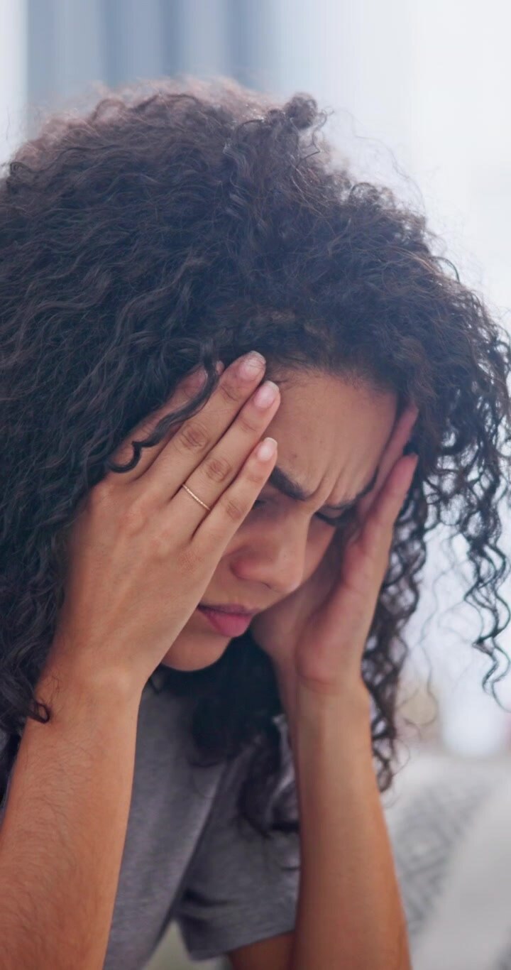 Young Woman Suffering From a Severe Headache
