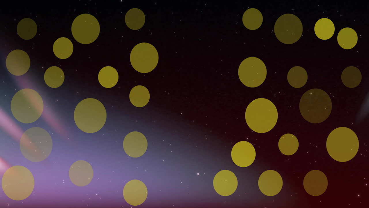 Animation of yellow light spots over defocused lights on dark background