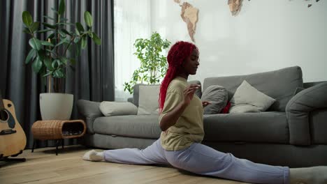 Beautiful-afro-american-woman-with-smile-sitting-on-split-at-living-room