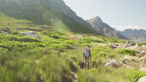 Sporty-mixed-race-man-with-prosthetic-leg-hiking