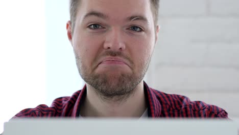 Yes, Young Man Accepting Offer by Shaking Head at Work