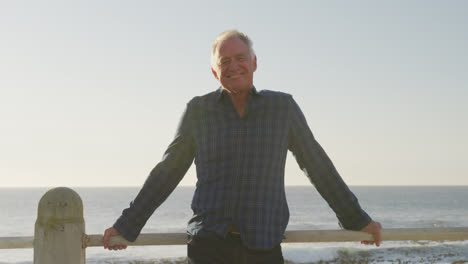 front view of senior man in front of beach