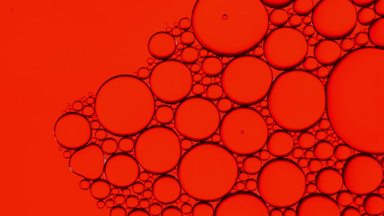 물 위에 떠다니는 기름방울의 다채로운 예술적. 추상적인 거품 배경