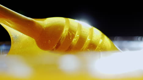 spoon with honey in backlighting hd video