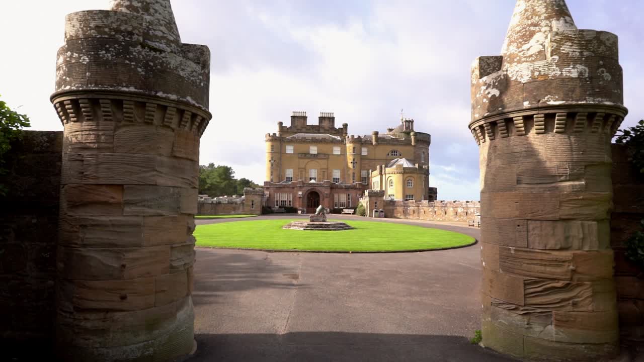 Pov shot walking towards the Culzean Castle, on a partly sunny day, in Carrick, Ayrshire coast of Scotland, UK