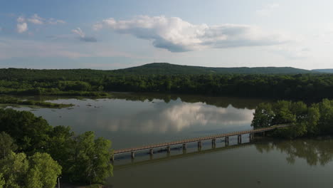 aerial view of lake sequoyah and bridge during sunset in arkansas, usa