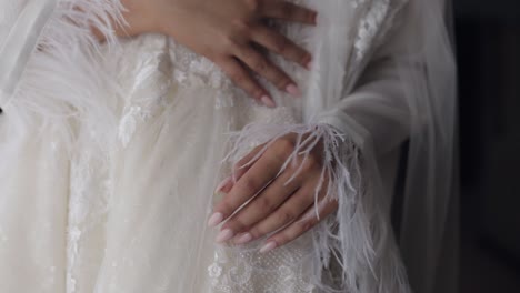 bride in a white dress with feathers