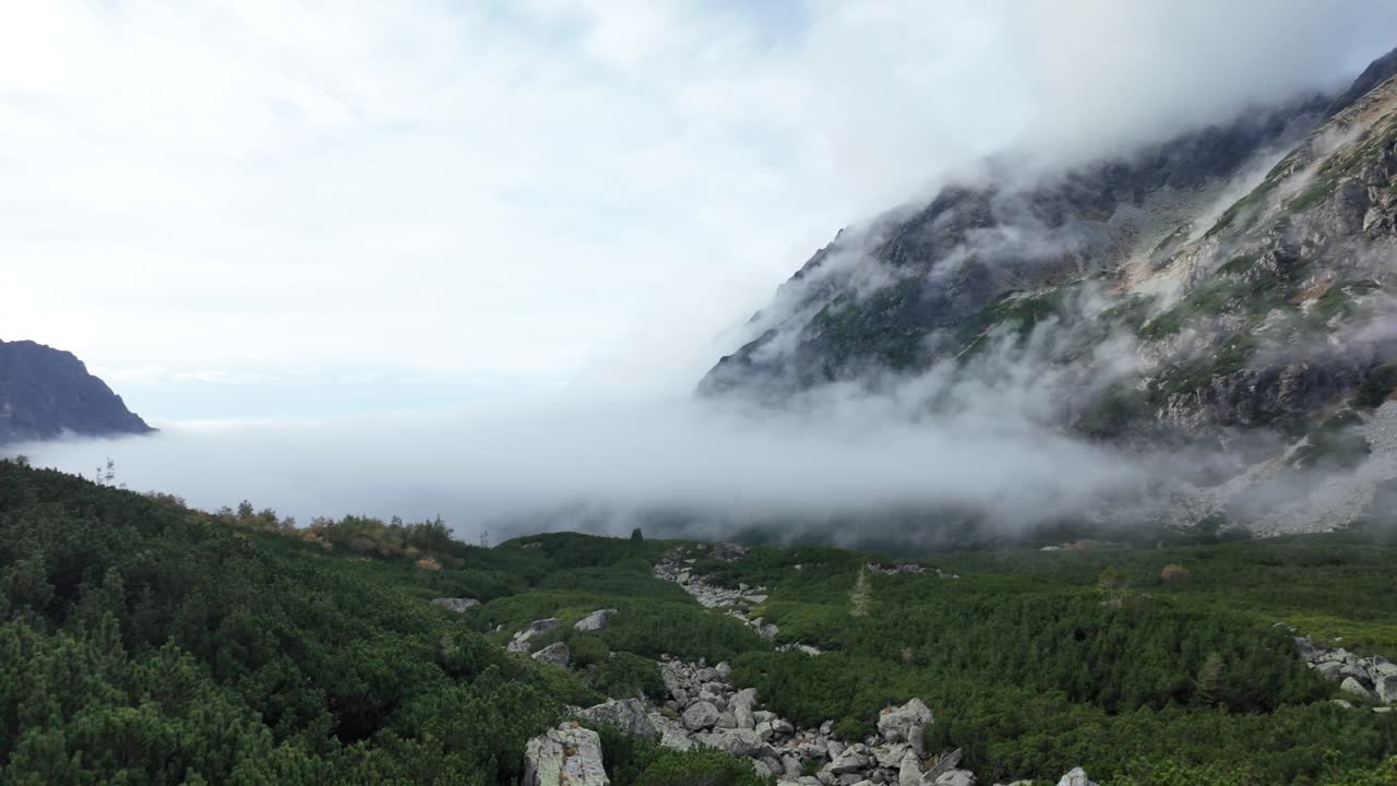 Mountain landscape, morning clouds hover over the mountains