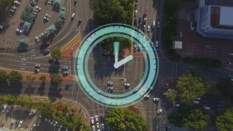 clock animation over aerial view of busy city intersection with traffic