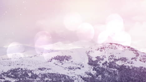 snow-covered mountains with bokeh lights animation over winter landscape scene