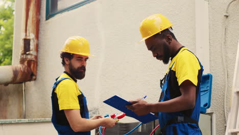 Repairman-doing-condenser-investigations