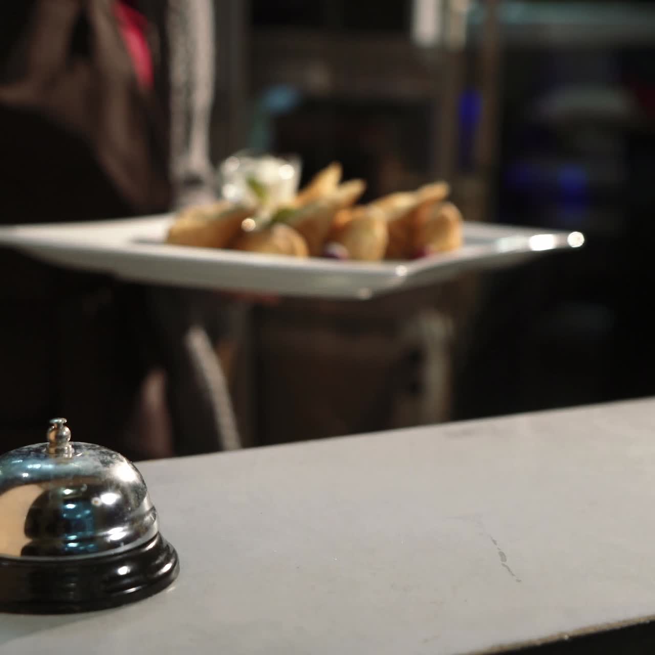 Waiter serving dessert at restaurant
