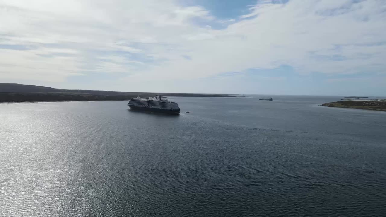 Cruise Ship Sailing in Calm Waters Near an Island