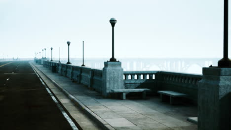 empty road on a foggy bridge