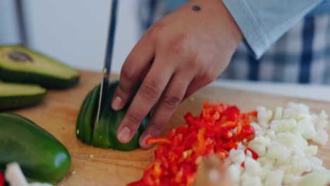 Cooking,-food-and-hands-with-knife-in-a-kitchen