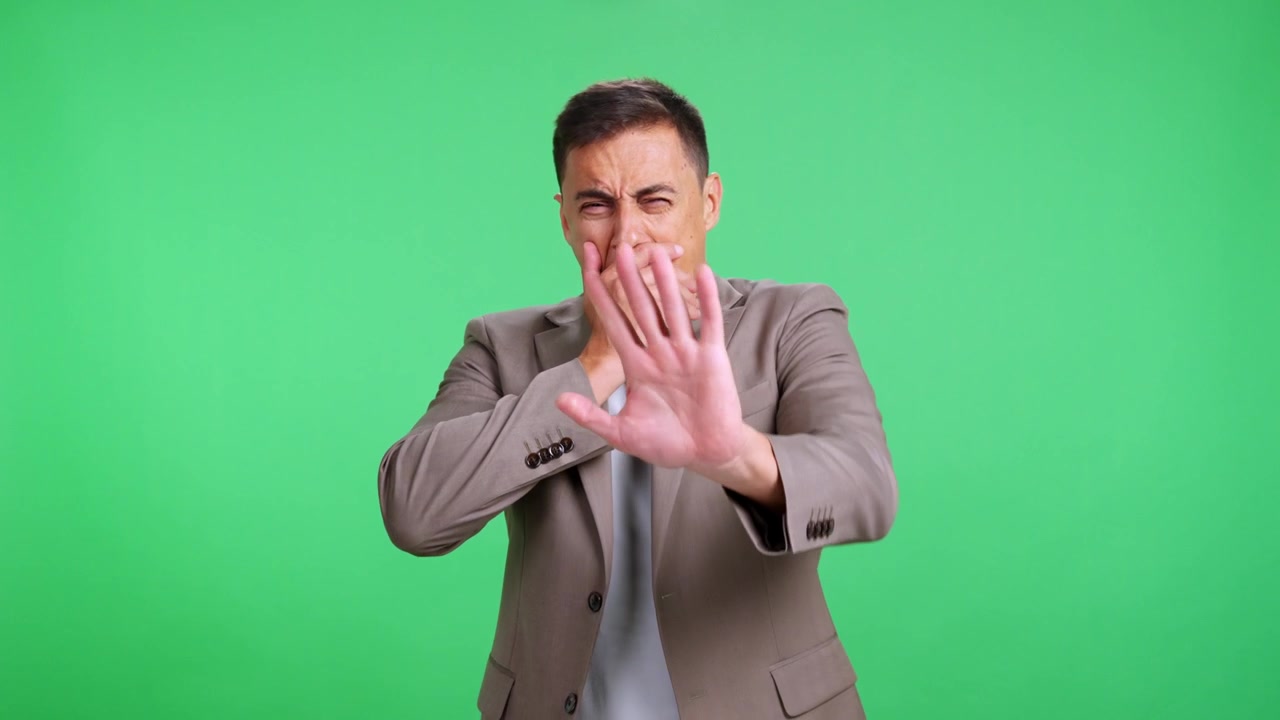 Tired sleepy businessman yawning on green screen