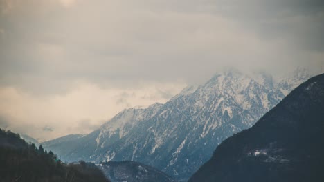 Timelpase-of-Large-Snowy-Alpine-Mountain-with-Clouds-Moving