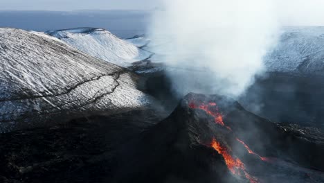 spatter cone volcano ejecting hot molten magma from earths core, aerial