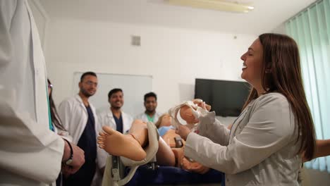 students engage in handson medical training with a realistic manikin in class to boost their learning.