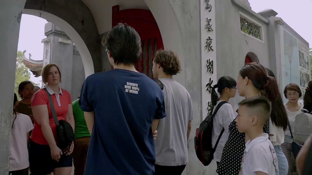 Hanoi, Vietnam - Local and tourist are entering one of the local attraction in the area -  close up