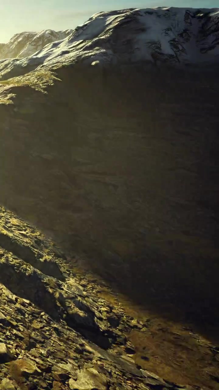 Mountain landscape with rocky terrain and sunlight in the evening
