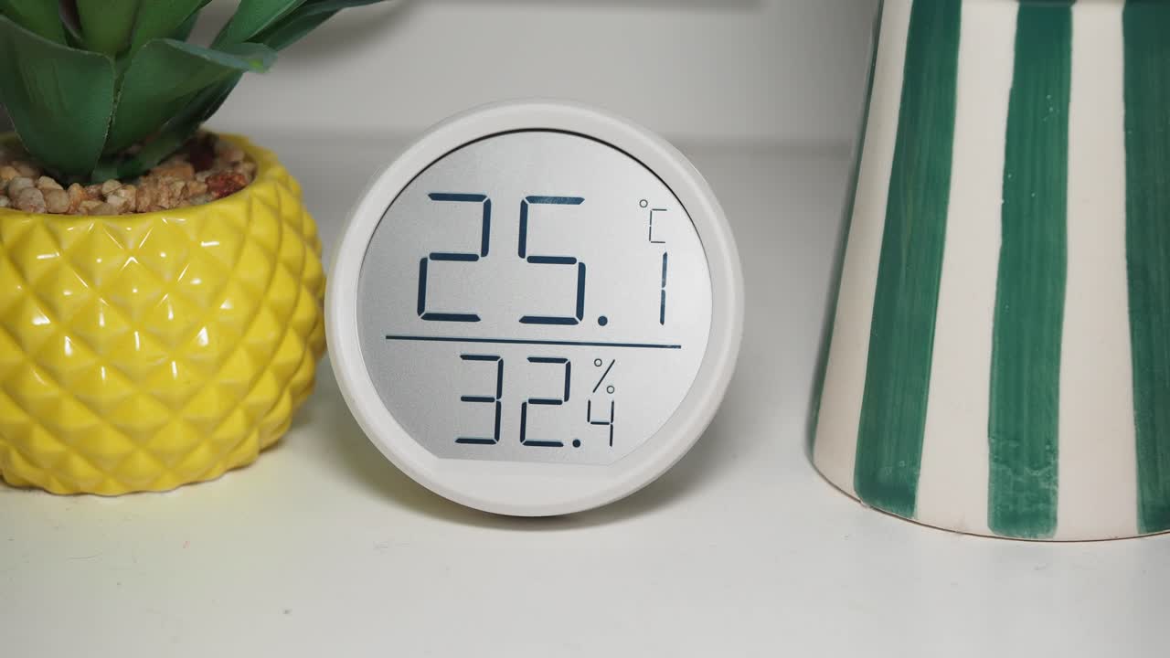 Digital Thermometer and Hygrometer Displaying Temperature and Humidity