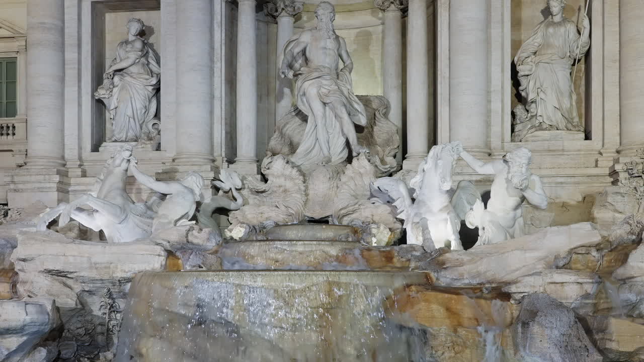 Statues of the Fontana di Trevi at night, Rome, Italy