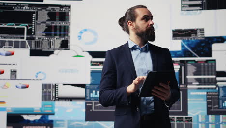 business expert reflecting on monthly performance metrics on dashboards