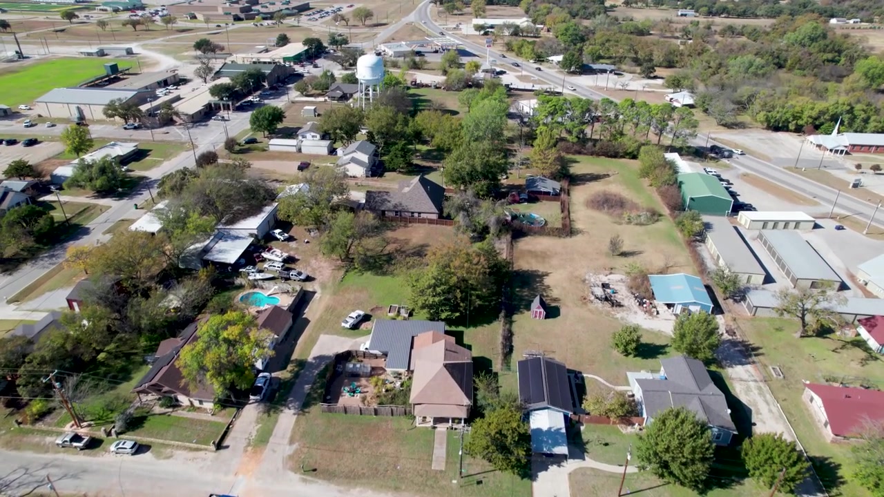 Aerial video of Boyd, Texas. Camera flies at a medium height above the rural town.