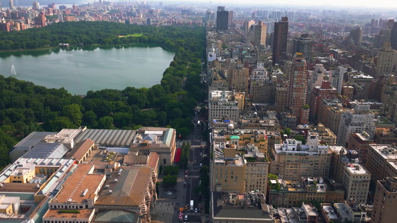 Aerial view flying along traffic on the 5th Avenue, golden hour in New York city
