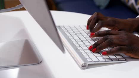 Hands-of-female-executive-typing-on-keyboard-at-desk