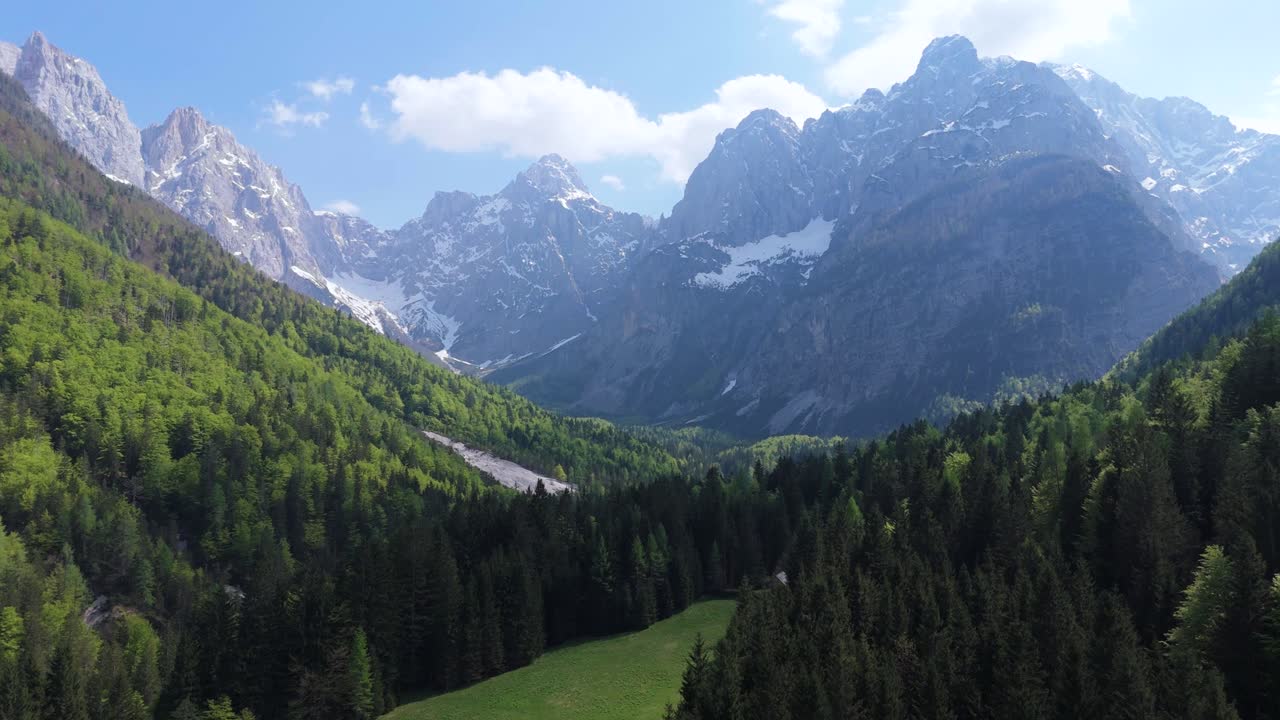Rugged Mountain Peaks Of The Julian Alps With Green Lush Forests In Triglav National Park, Slovenia. Aerial Drone Shot