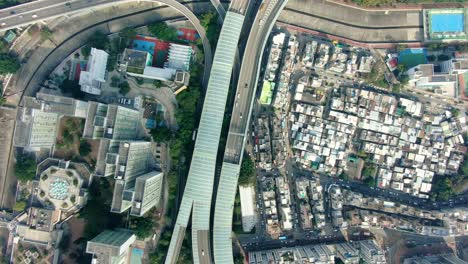 Rascacielos-Del-Centro-De-La-Ciudad-De-Hong-Kong-Y-Tráfico-Urbano,-Vista-Aérea