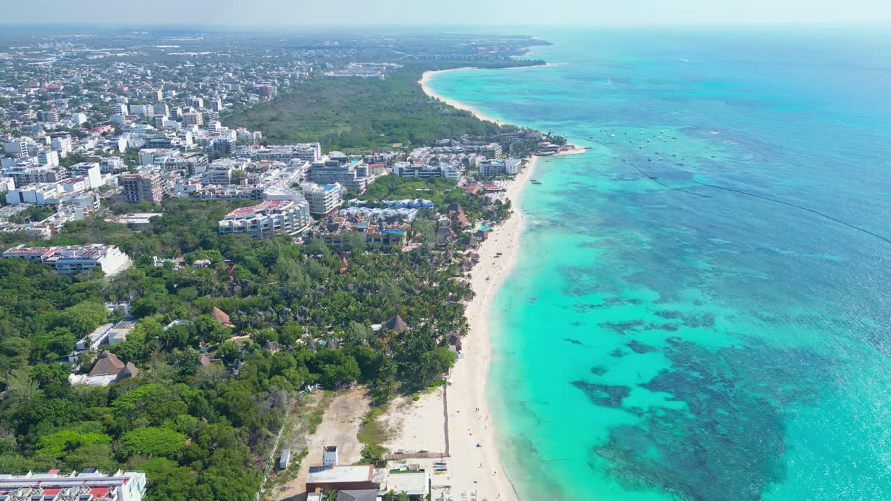Playa del carmen beach with turquoise water and sunny coastline, aerial view