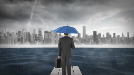composite image of businessman holding an umbrella