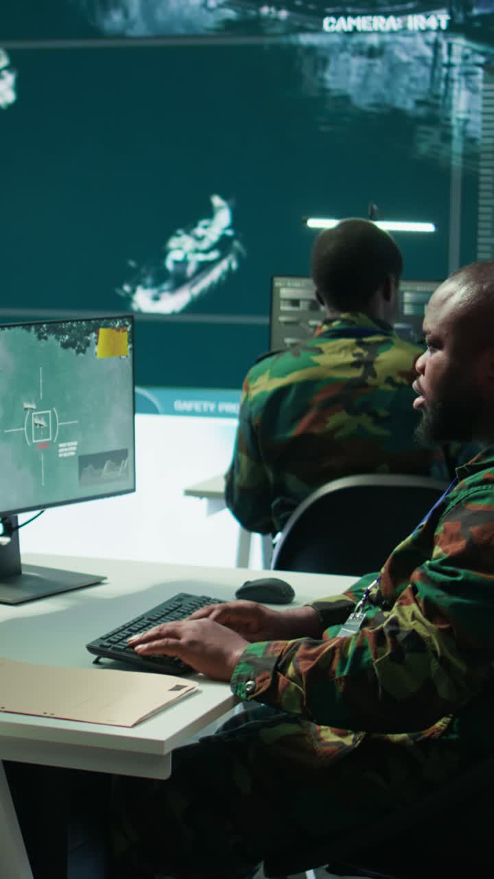 Vertical Video Army intelligence specialists using advanced computer systems and satellite data