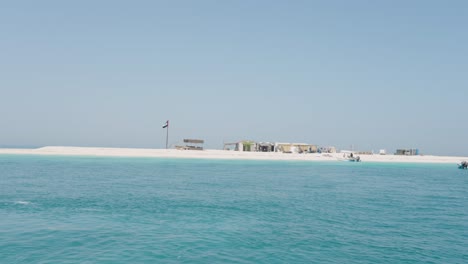 island in the arabian sea off the coast of abu dhabi united arab emirates crystal clear blue water