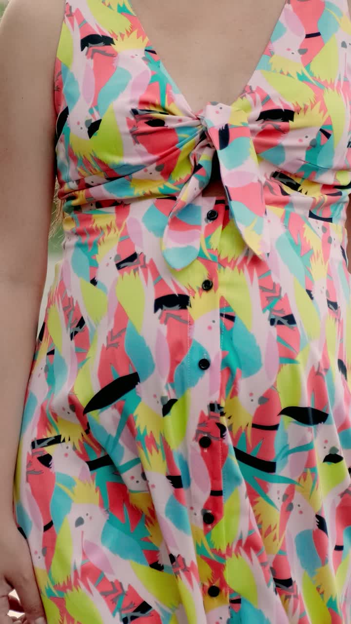 Woman in colorful dress and straw hat