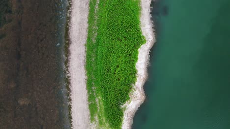 Aerial-bird's-eye-view-of-small-lush-green-island-found-at-Canyon-lake-in-Texas