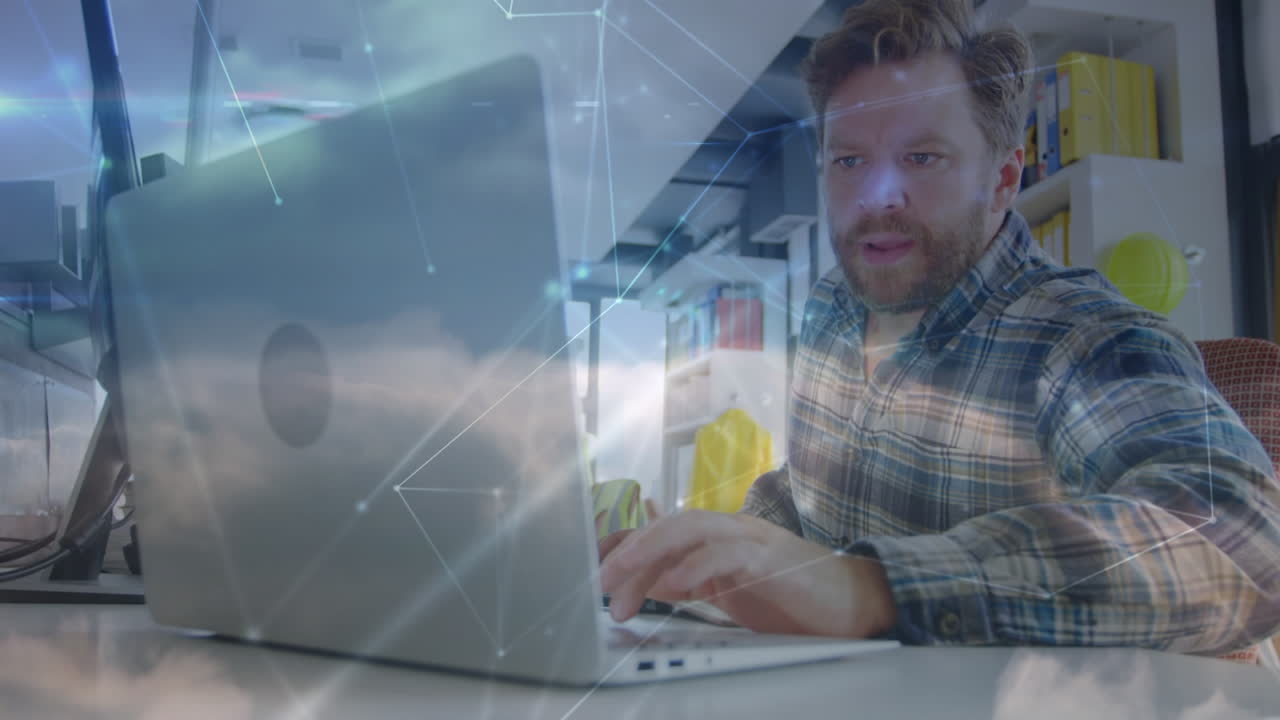 animación de conexiones sobre hombre caucásico trabajando en una computadora portátil en la oficina
