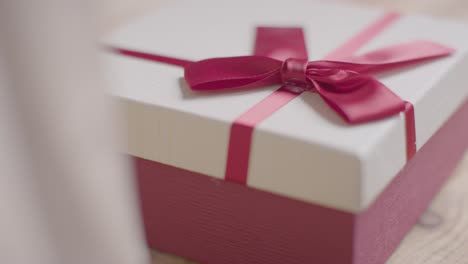 Close-Up-Of-Romantic-Valentines-Present-In-Gift-Wrapped-Box-On-Table-1