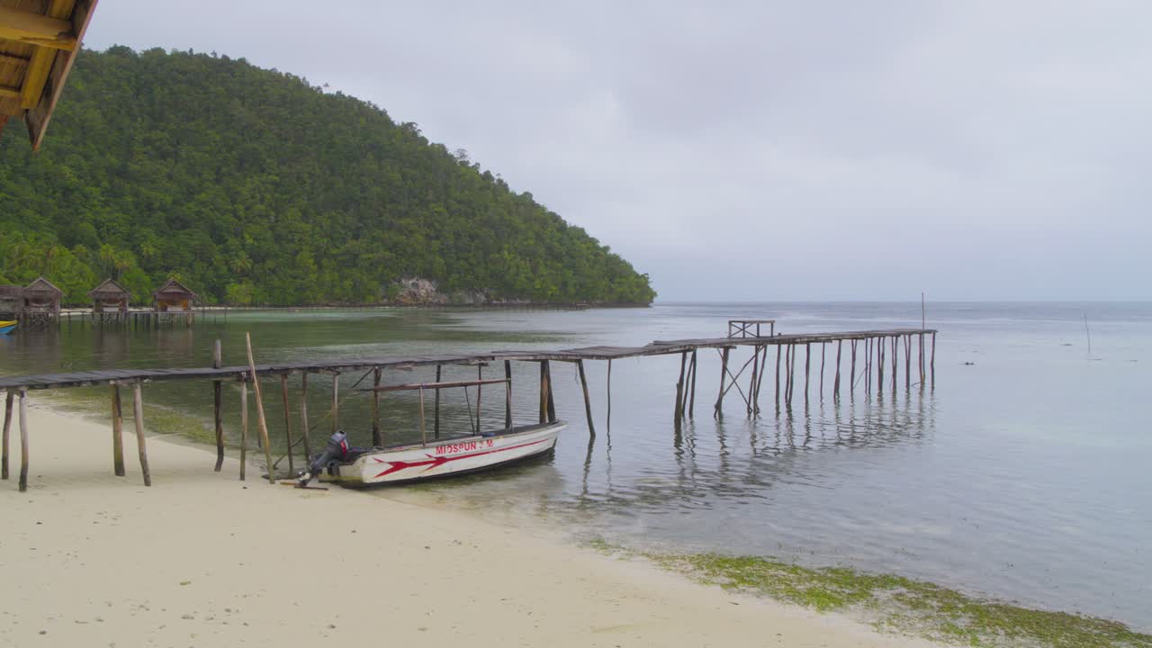 Tranquil Tropical Coastal Scene with Boat and Pier