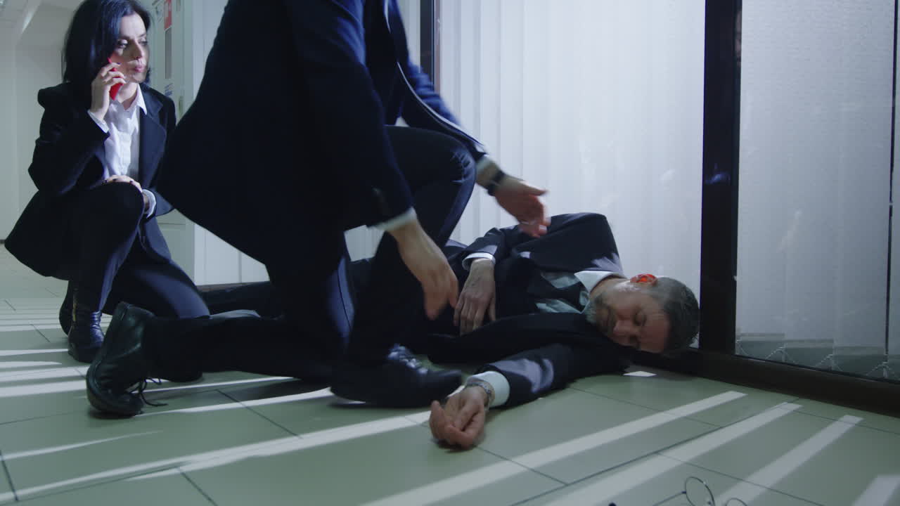 Man Unconscious on Office Floor Receives First Aid