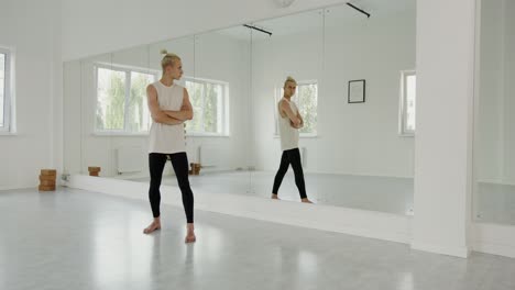 woman doing yoga in a studio