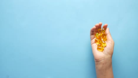 handful of fish oil capsules