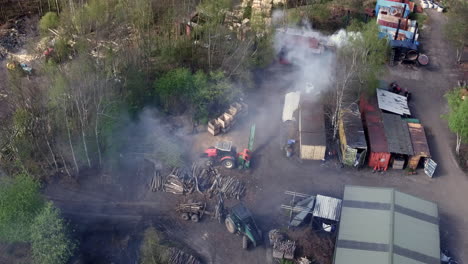 Aerial-view-of-an-unrecognizable-smoky-woodyard