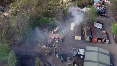 aerial view of an unrecognizable smoky woodyard