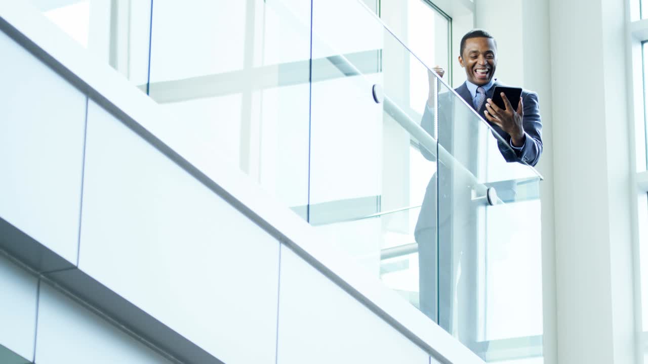African American businessman using tablet in city office